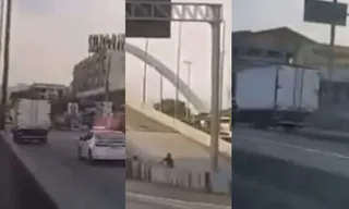 Imagem ilustrativa da imagem Suspeito salta de caminhão roubado e foge a pé na Av. Brasil; vídeo