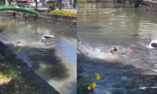 Imagem ilustrativa da imagem Carro cai em canal no Rio e ocupantes são resgatados; veja vídeo