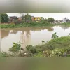 Imagem ilustrativa da imagem Mulher desaparece após cair em rio durante chuva na Baixada