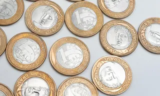Imagem ilustrativa da imagem Nova moeda de R$ 1 começa a circular no Brasil; veja detalhes