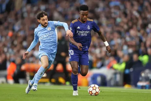 Bernardo Silva e Vinicius Junior foram dois dos destaques do grande jogo em Manchester