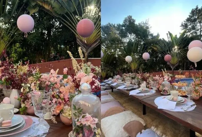 Decoração contou com mesa ao ar livre, louças de luxo e balões rosa