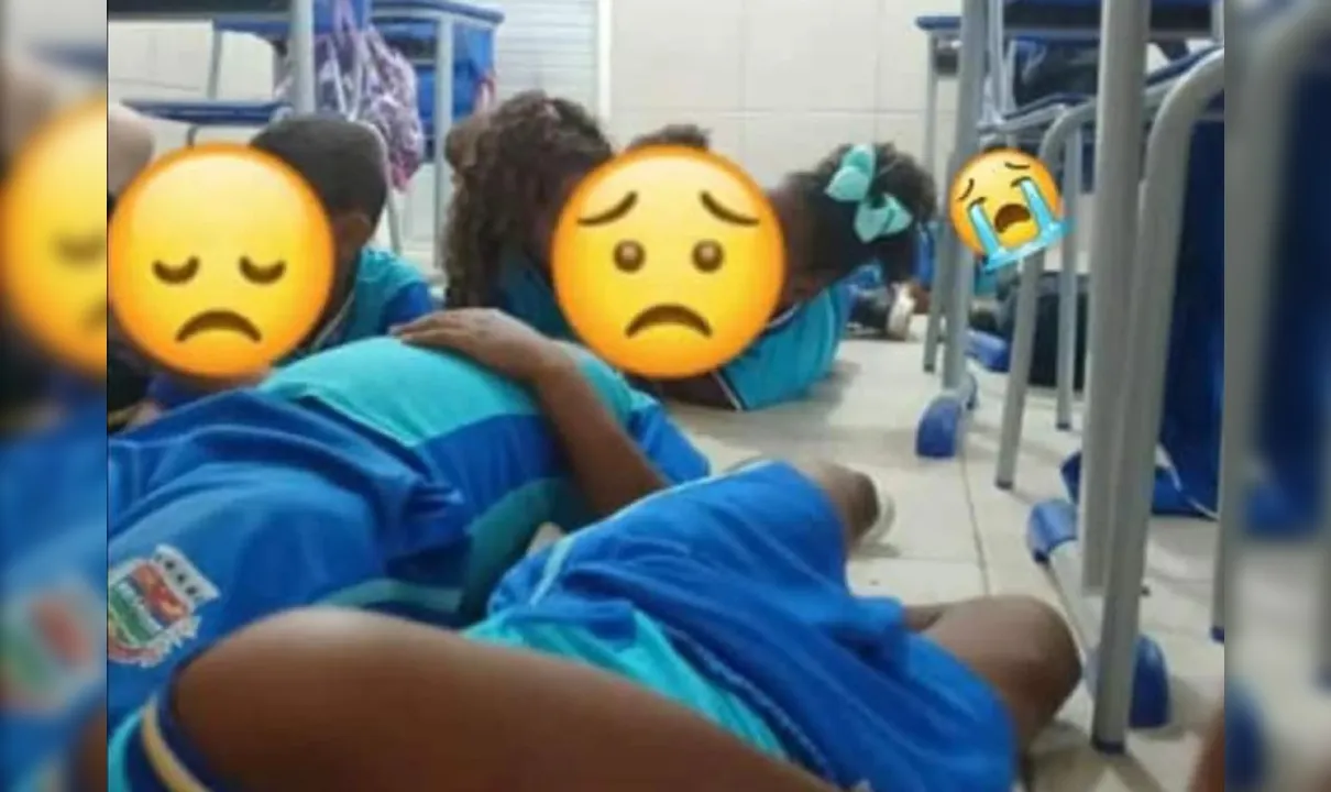 Crianças deitadas no chão durante operação no Complexo do Salgueiro, em São Gonçalo