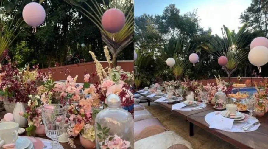 Decoração contou com mesa ao ar livre, louças de luxo e balões rosa